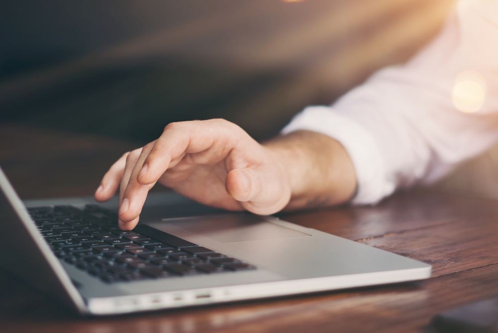 fingers on a laptop